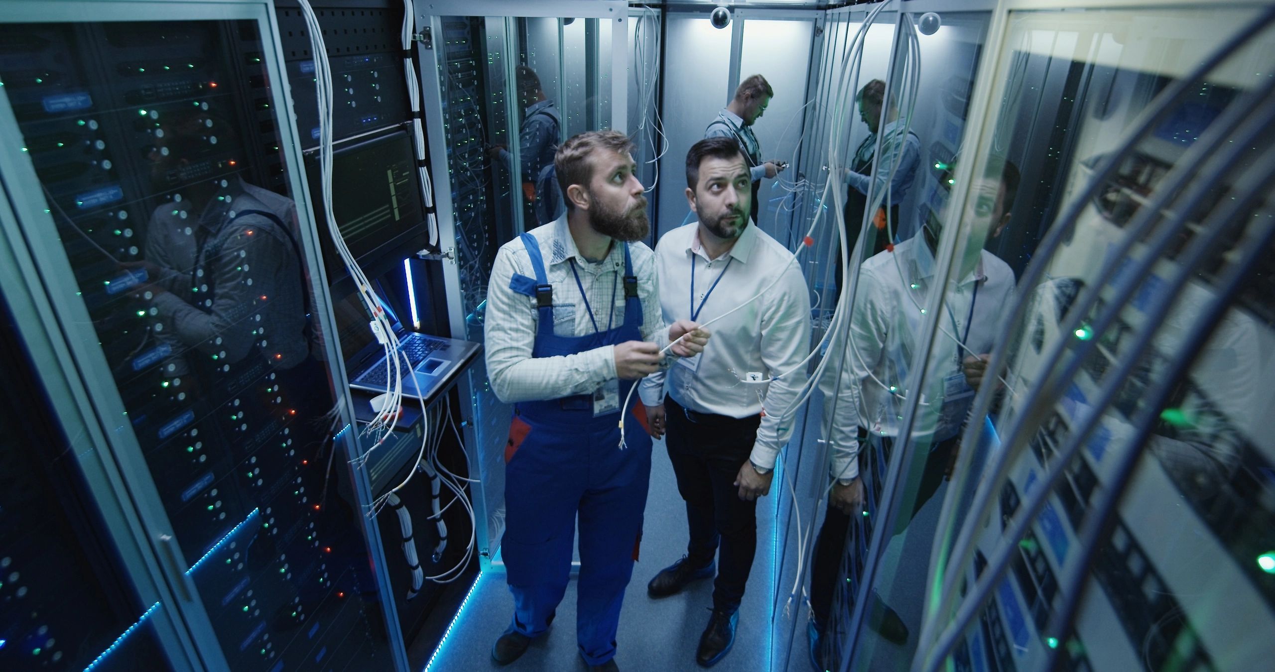 Technicians working in a professional data center environment
