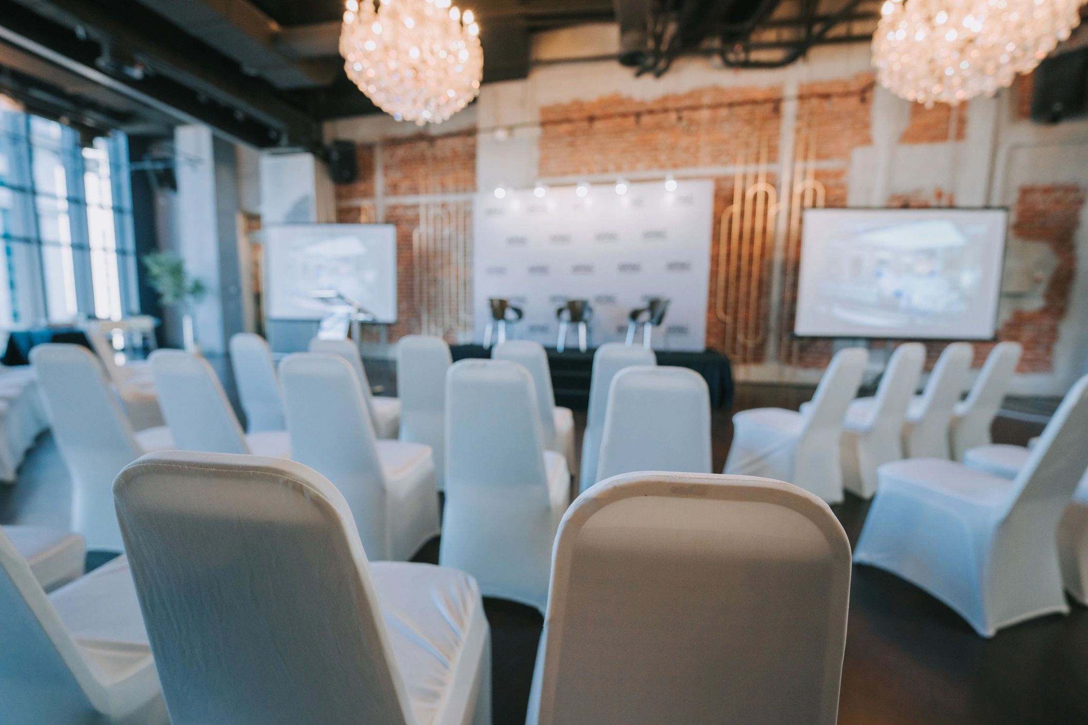 Conference and presentation room with screen and seating